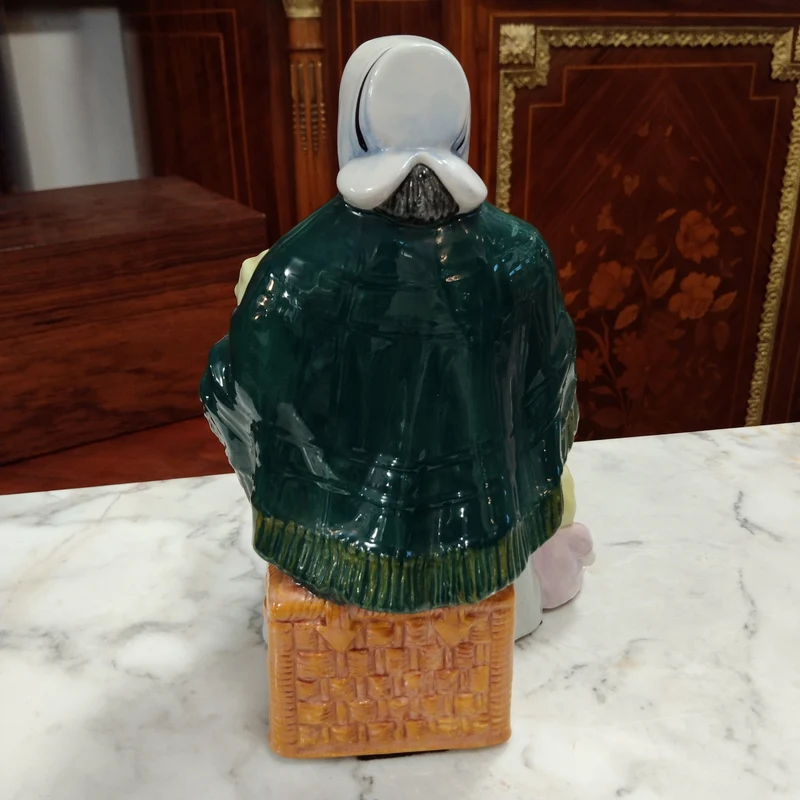Royal Doulton porcelain figurine 'The rag doll seller' 1989