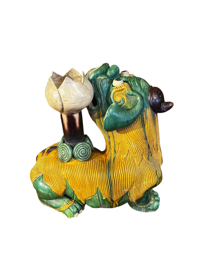 Chinese glazed ceramic figure of a Fo dog with a lotus flower
