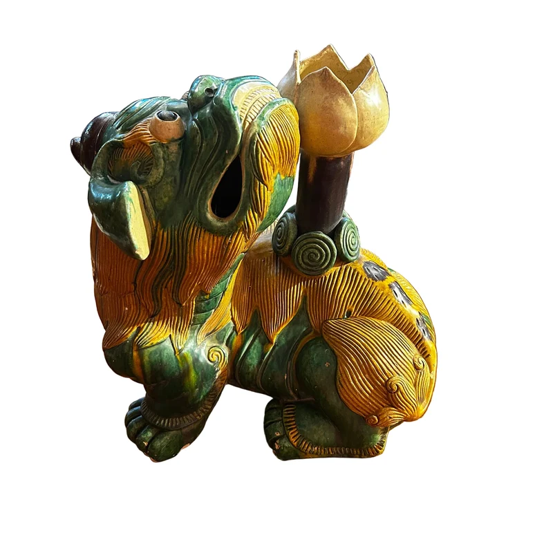 Chinese glazed ceramic figure of a Fo dog with a lotus flower