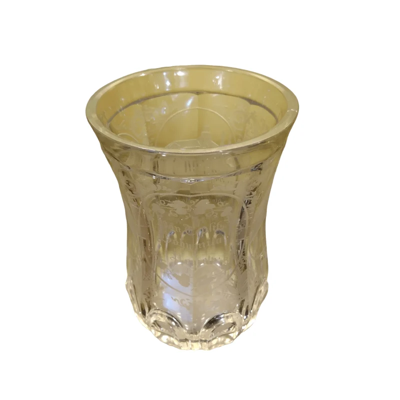 Transparent worked glass vase with architectural designs