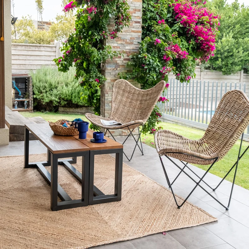 Contemporary Scandinavian Handwoven Rattan Lounge Chair - Accent Chair With Ergonomic Backrest & Iron Base For Boutique Indoor & Outdoor Spaces