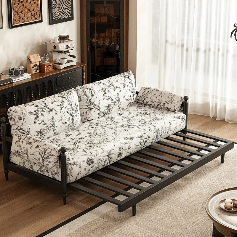 Sofá cama Gland con estructura de madera maciza de fresno y tapizado en tela de terciopelo estampada.