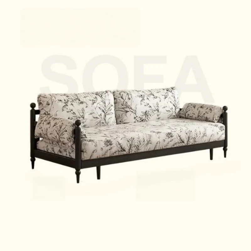 Sofá cama Gland con estructura de madera maciza de fresno y tapizado en tela de terciopelo estampada.