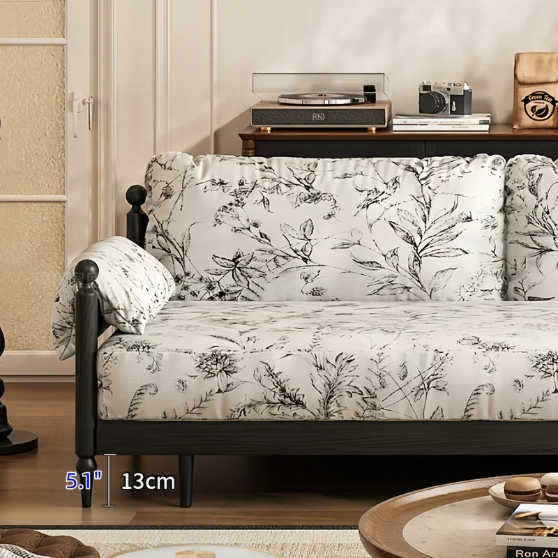 Sofá cama Gland con estructura de madera maciza de fresno y tapizado en tela de terciopelo estampada.