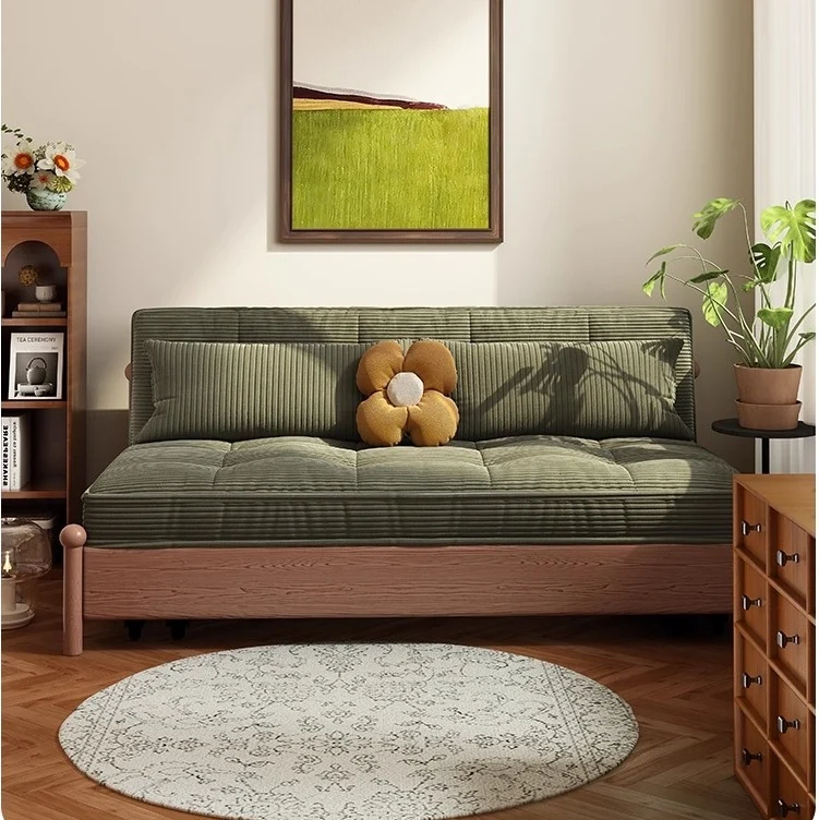 Sofá cama con estructura metálica y tapizado en pana, con espacio de almacenamiento debajo.