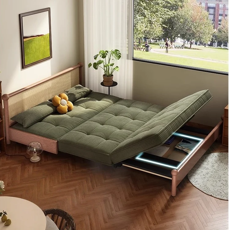 Sofá cama con estructura metálica y tapizado en pana, con espacio de almacenamiento debajo.