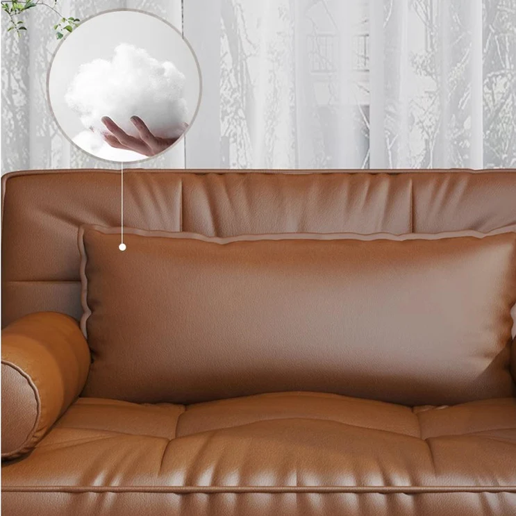Sofá cama retro de cuero con reposabrazos de tejido de ratán y espacio de almacenamiento debajo.