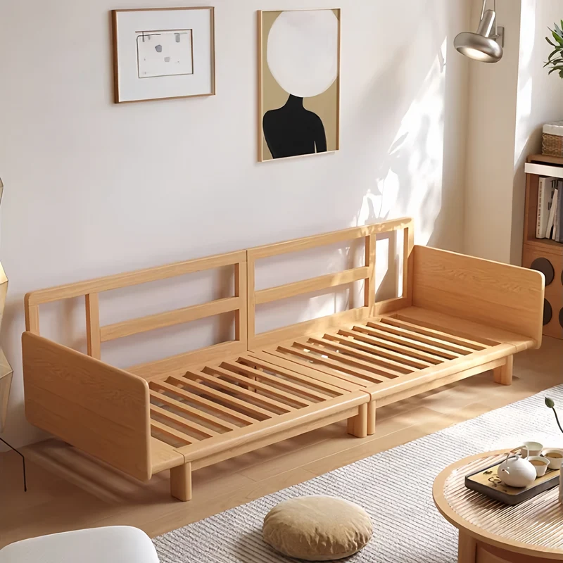 Sofá cama Japandi con estructura de madera maciza y tapizado en tela de pana.