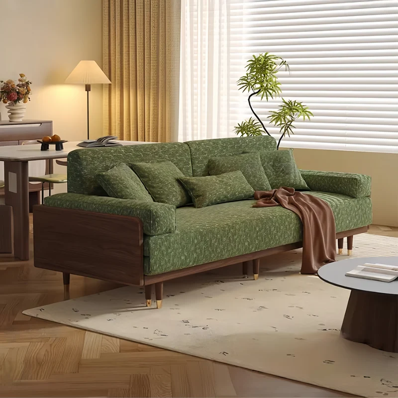 Sofá cama de madera maciza de fresno con tapizado de tela chenilla con estampado de trébol de cuatro hojas.