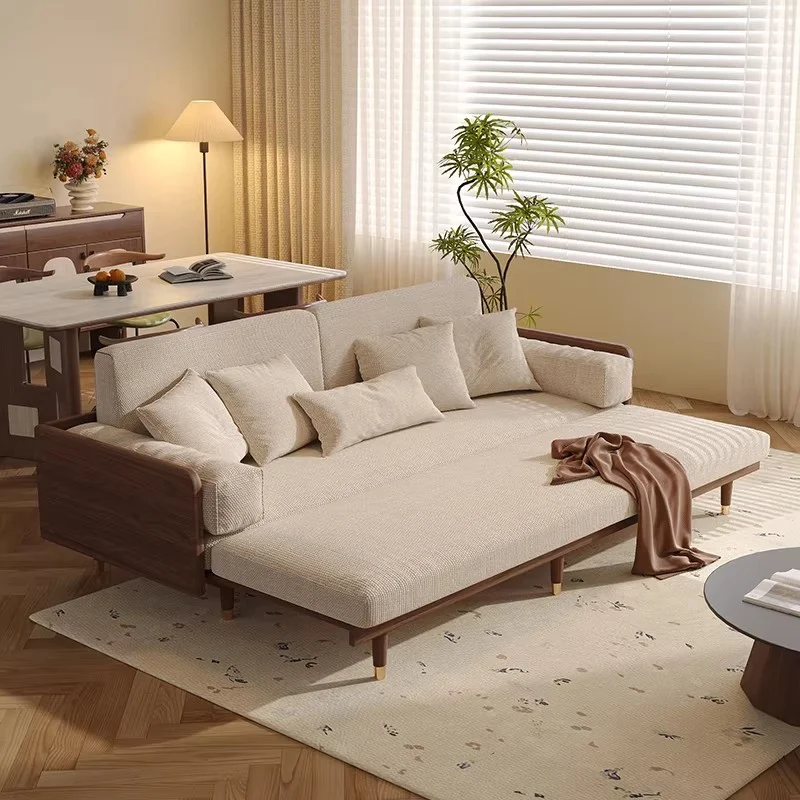 Sofá cama de madera maciza de fresno con tapizado de tela chenilla con estampado de trébol de cuatro hojas.
