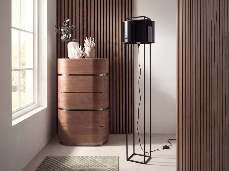 Black steel floor lamp with black PVC shade and gold interior