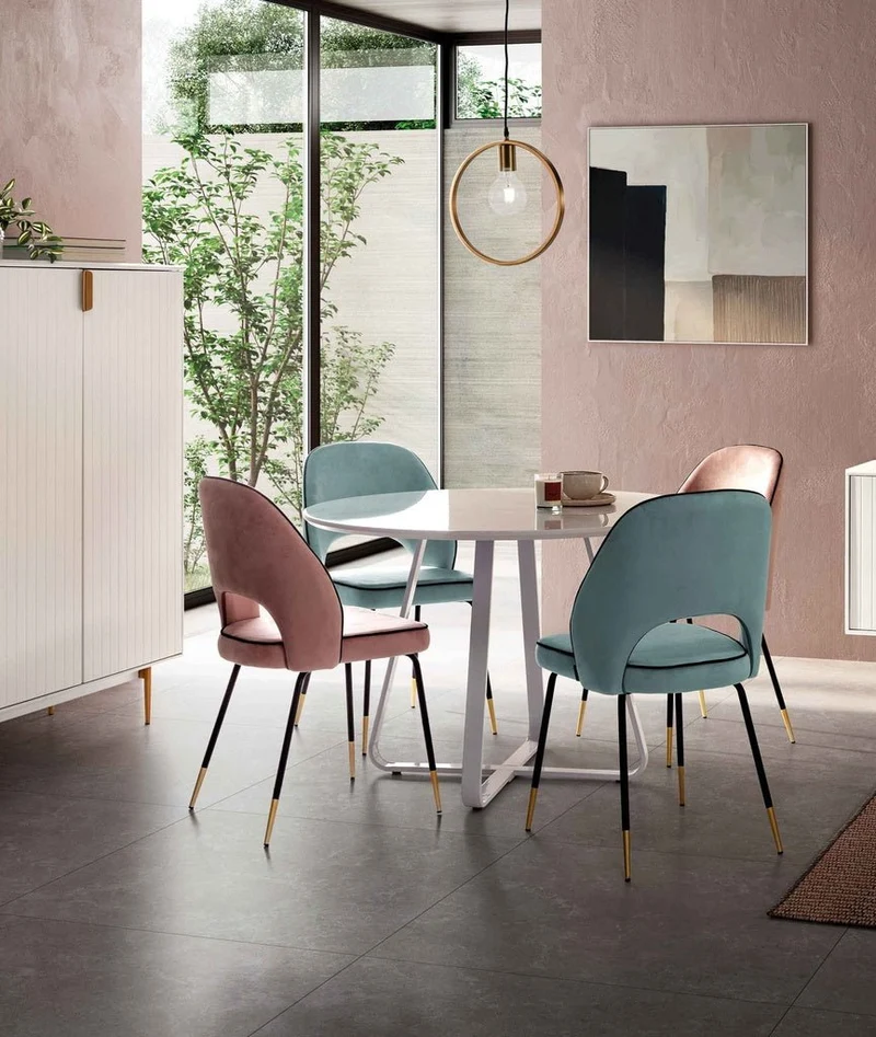 Chair upholstered in light blue velvet