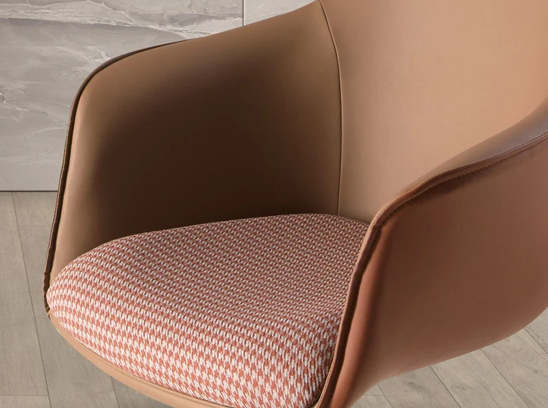 Swivel chair in terracotta and beige fabric and brown faux leather