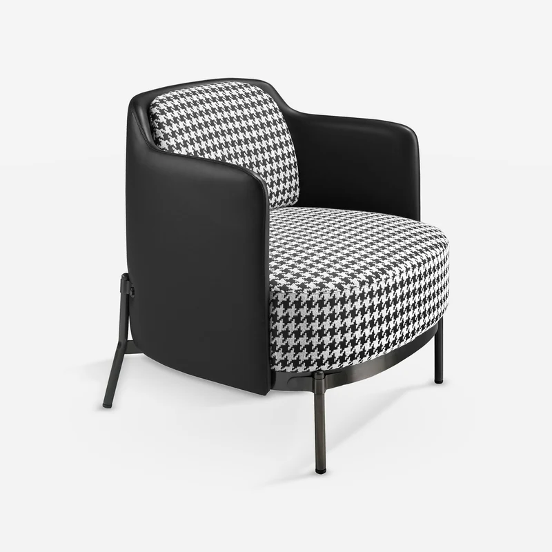 Armchair in black and white fabric and black leatherette