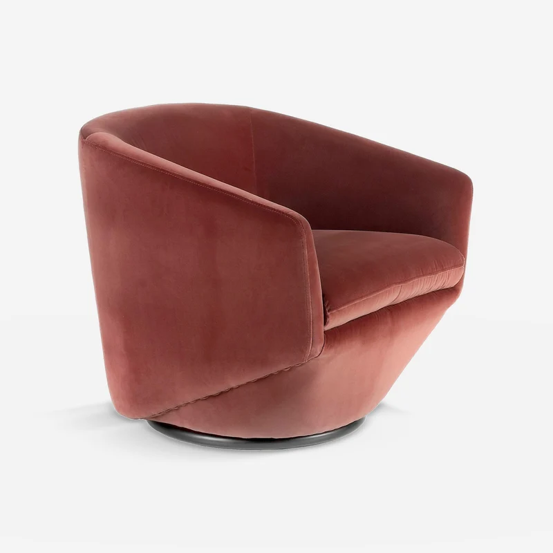 Peach velvet swivel armchair