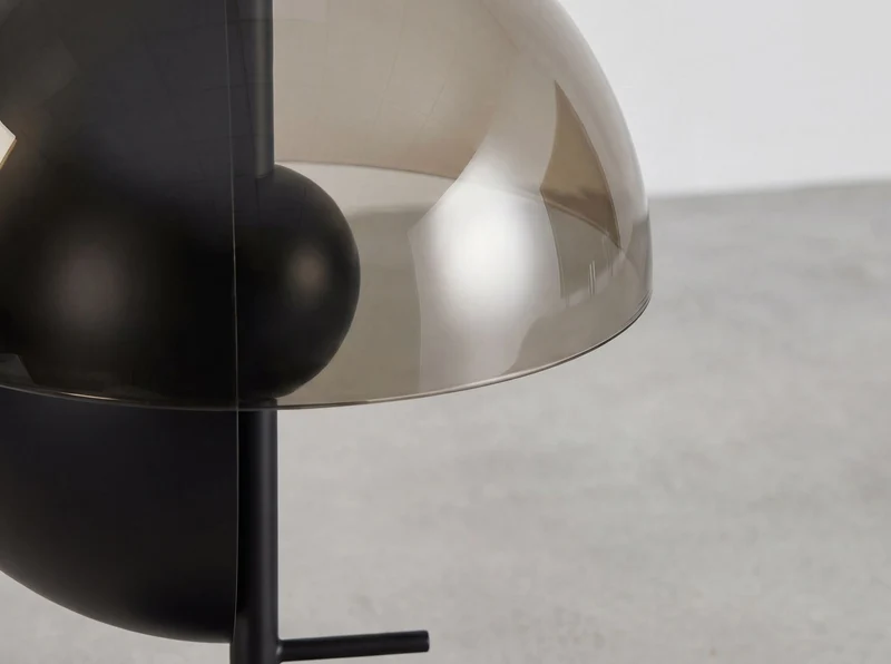 Smoked amber glass and black and white steel table lamp with black steel base