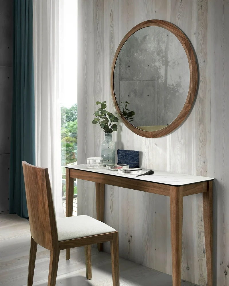 Round walnut wall mirror