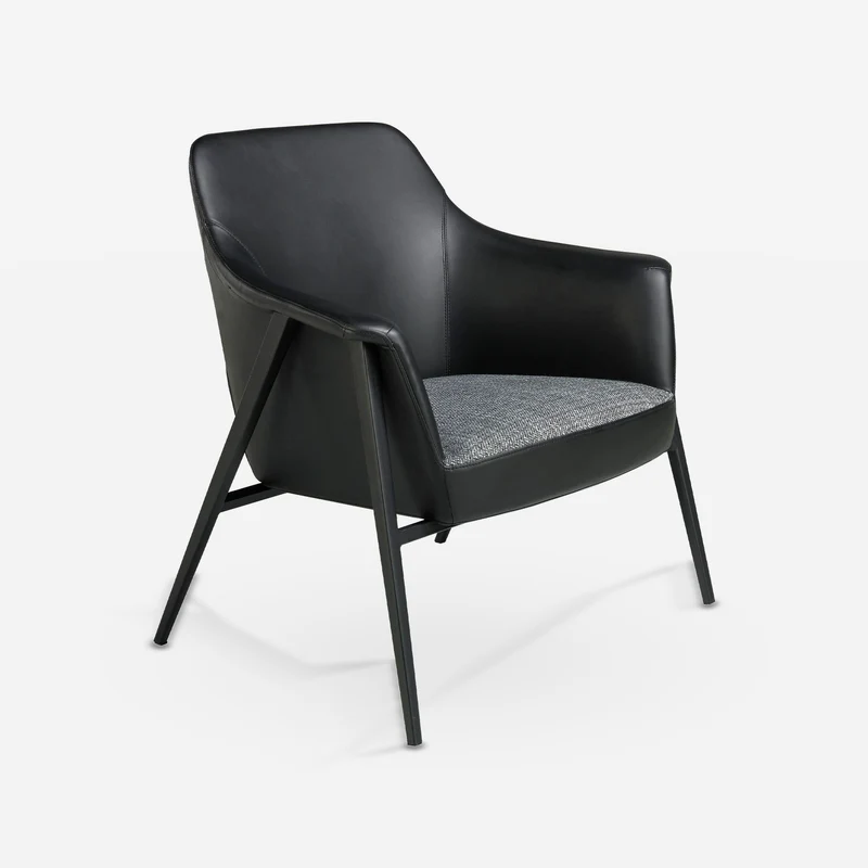 Grey fabric and black leatherette armchair